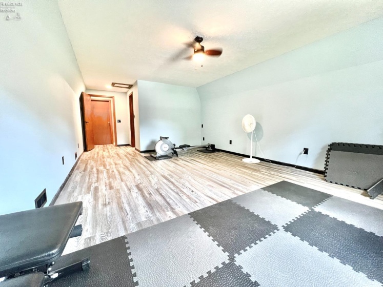 bedroom #4 over garage currently used as home gym