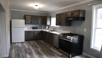 Spacious eat-in kitchen with refrigerator, range and dishwasher