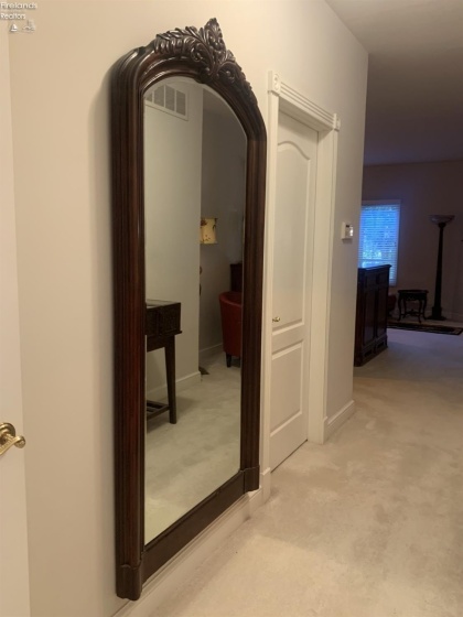 Door pictured leads into the first large walk-in closet in the owner's suite