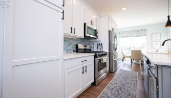 3rd floor eat-in kitchen, soft close drawers, stainless steel appliances.