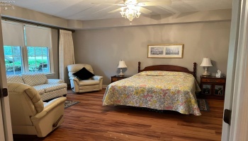Main floor bedroom suite with large bathroom & door to laundry.