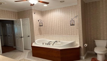 Main floor master bath with jet tub, stand up shower & double sinks