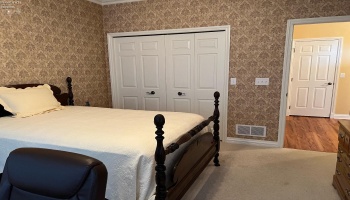 2nd main floor bedroom that could also be an office.  2nd main floor guest bath just outside of the door in foyer area.
