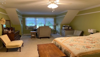 2nd floor large bedroom with full bath.  Huge walk in closet and attic storage room.