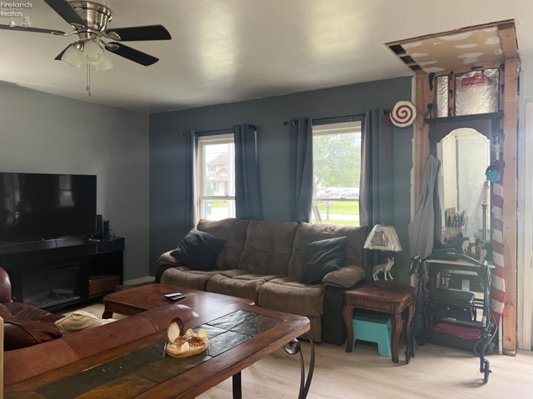 Owner started renovations with nice lux vinyl plank flooring on the first floor. This closet area was taken out and drywall onsite to complete for next buyer.