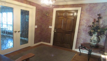 11'x10' foyer with leaded glass double doors leading to the formal dining room and sitting room