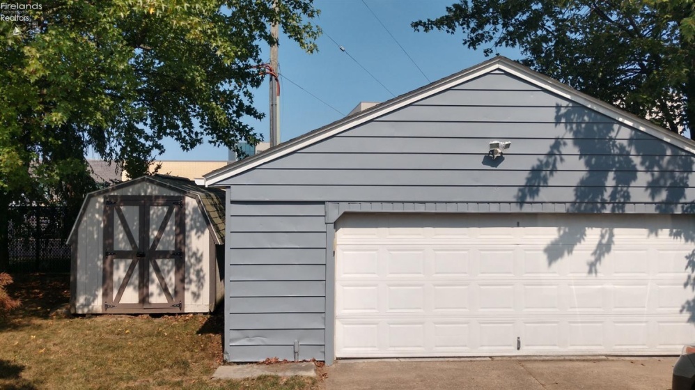 Very large garage with electric opener and new wiring to the outlets.