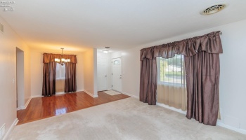 Living room, dining area and front entry.