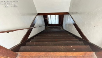 Stairs to front entrance for upper unit. Owner does not have keys to front door. Lock would need to be replaced.