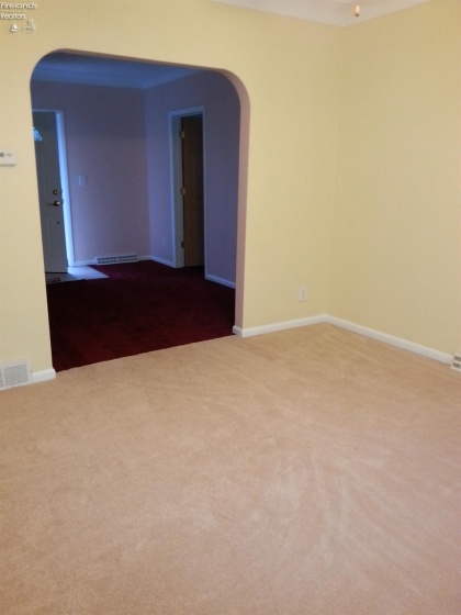 Dining room looking into living room front of house