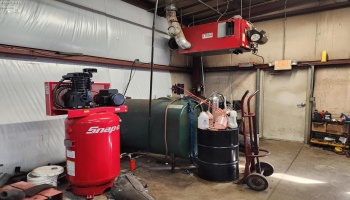 Inside the newer metal building, compressor, waste oil heater. Inside the newer metal building, compressor, waste oil heater.