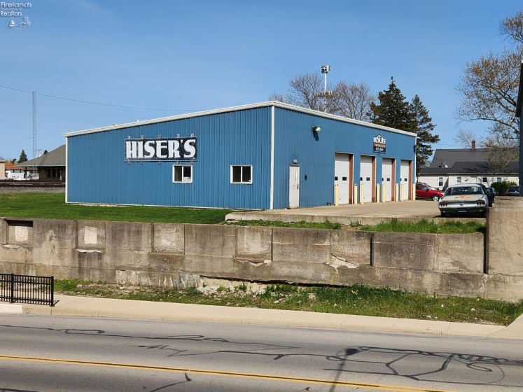 The metal building is newer.