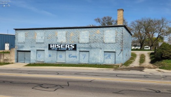 The block building has 2 floors and is used as a storage building, the stone driveway to the right belongs with this property. The block building has 2 floors and is used as a storage building, the stone driveway to the right belongs with this property.