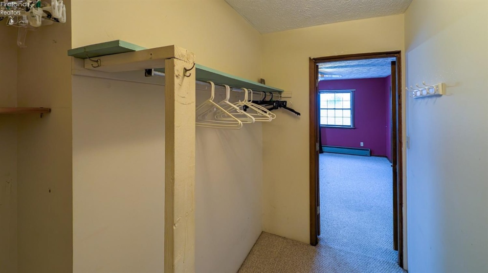 Walk-in closet in primary bedroom