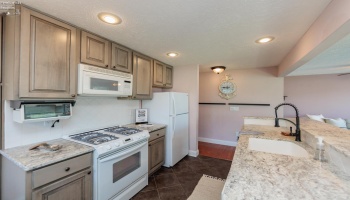 Guest suite with your own private entrance, patio, and driveway - Equipped with full living quarters - 2 bedrooms - 1 full bath. A great option to possibly rent out as well. The possibilities are endless. No transient rentals allowed.