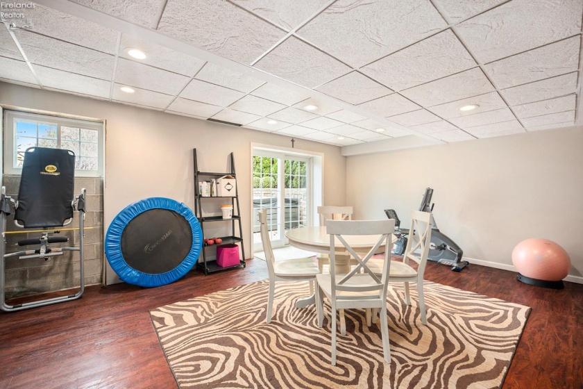 basement family room/ door to outside patio