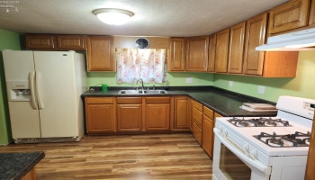 Kitchen with tons of cabinet and counter space, appliances stay. Kitchen with tons of cabinet and counter space, appliances stay.