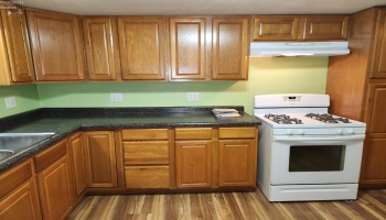 Kitchen with tons of cabinet and counter space, appliances stay. Kitchen with tons of cabinet and counter space, appliances stay.