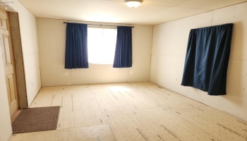 Front living room, could be a possible bedroom. Front living room, could be a possible bedroom.