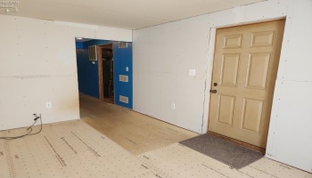 Front living room, could be a possible bedroom. Front living room, could be a possible bedroom.