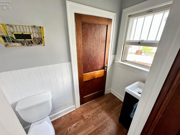 half bath main level, doors to downstairs bedroom and mud room