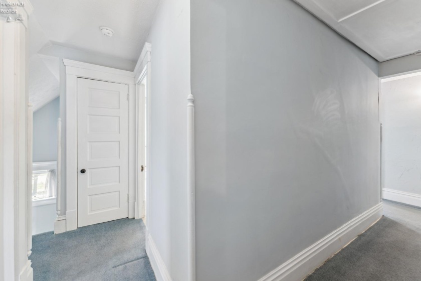 Upstairs hallway with access to four bedrooms, front and bath staircases and full bath