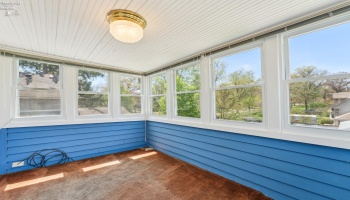 Sleeping/sitting porch or sunroom with western sunset views and overlooking the rear garden