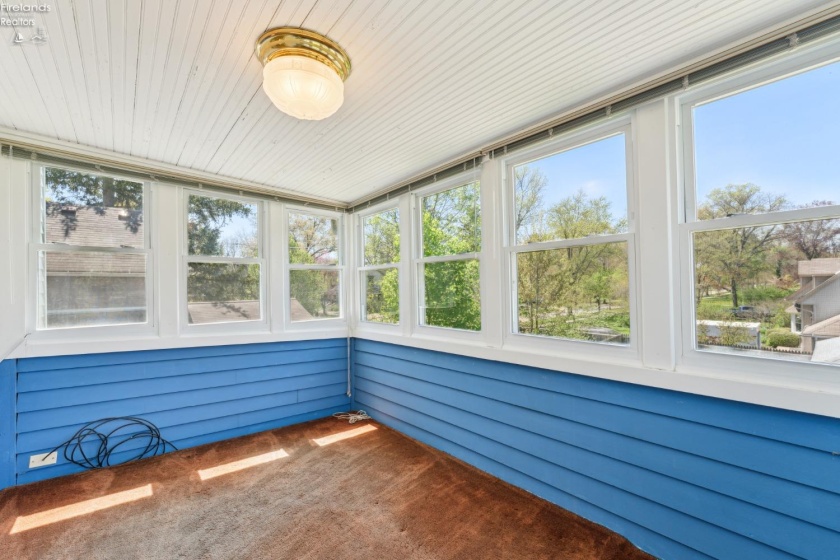 Sleeping/sitting porch or sunroom with western sunset views and overlooking the rear garden