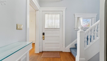 Entry foyer with coat closet and built-in console