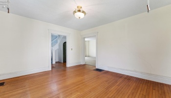 Front living room/parlor for formal seating and view to the front sidewalk and direct access from foyer