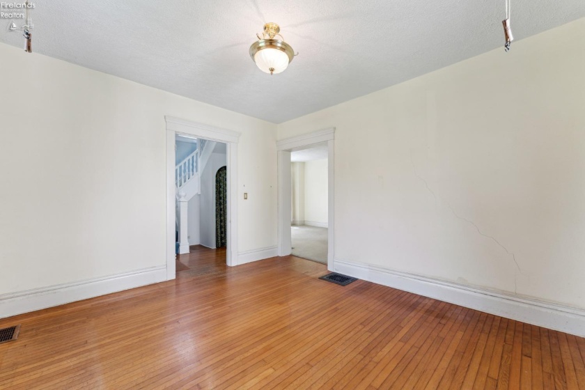 Front living room/parlor for formal seating and view to the front sidewalk and direct access from foyer