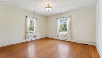Front living room/parlor for formal seating and view to the front sidewalk and direct access from foyer