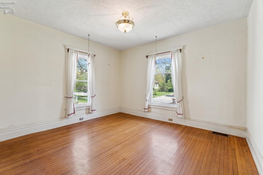 Front living room/parlor for formal seating and view to the front sidewalk and direct access from foyer