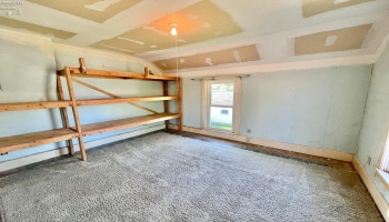 Used as a storage room. Shelves to stay
