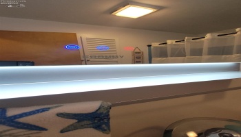 Multi-functional mirror in main floor bath