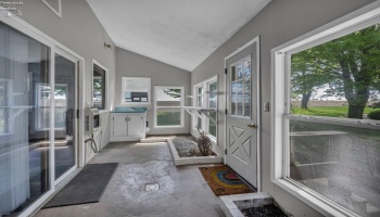 Enclosed sun porch with endless possibilities.