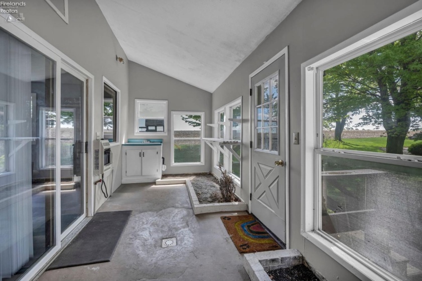Enclosed sun porch with endless possibilities.