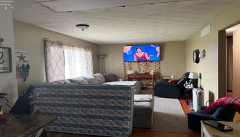 Living room area is now open to the kitchen- ceilings will need to be refinished