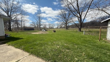 Backyard view from driveway.