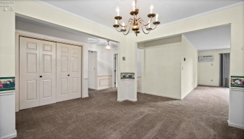 Dining room looking into living room and hallway to the bedrooms