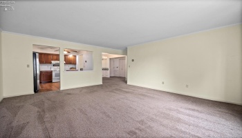 Living room looking into kitchen and dining room
