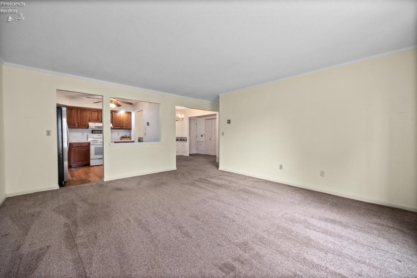 Living room looking into kitchen and dining room
