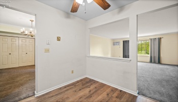 Kitchen looking into living room and dining room