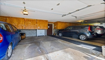 Garage space with 1 parking and storage cabinets