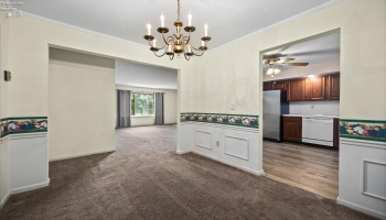 Dining room looking into living room and kitchen