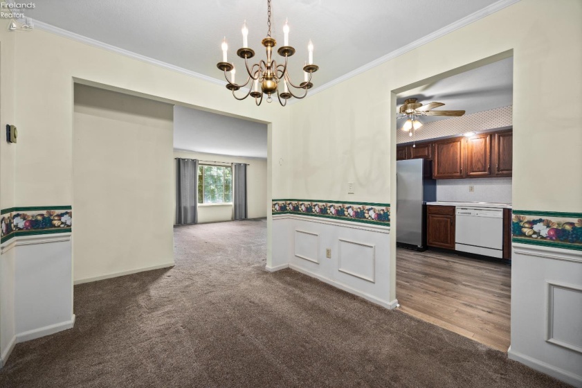Dining room looking into living room and kitchen