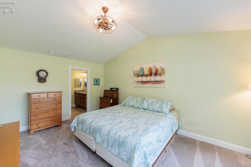 Master bedroom suite with private bathroom and walk-in closet