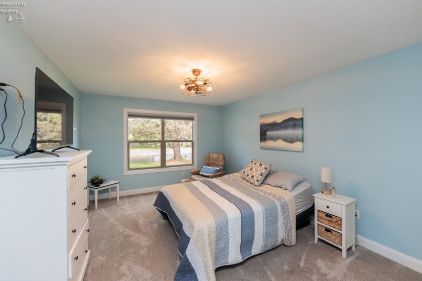 Bedroom 3 with view of pond.