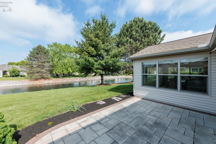 View from back patio, offering an retractable awning