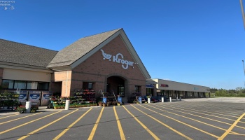 Photo showing plaza in relation to Kroger (Kroger building is not included in the sale).